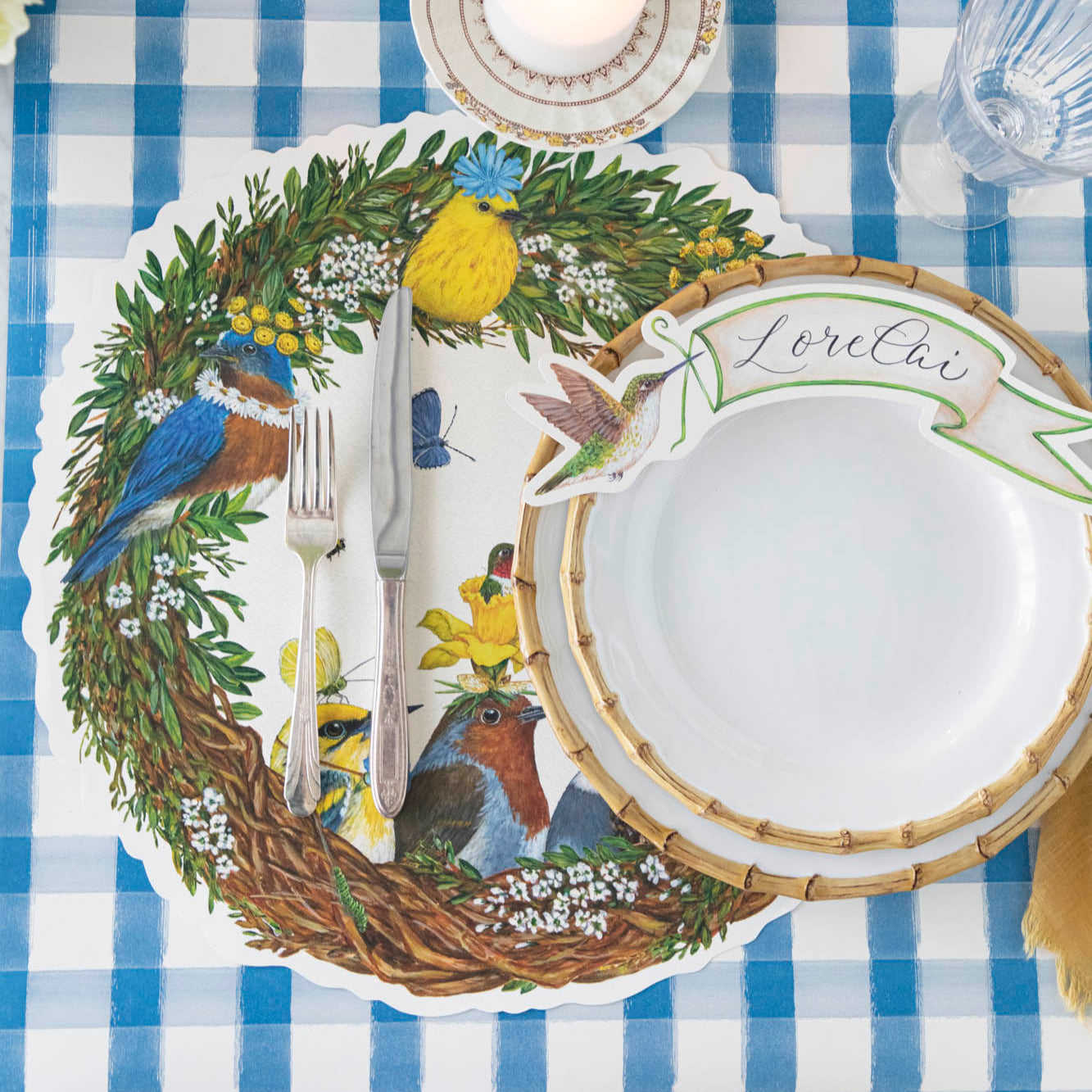 Songbird Wreath Placemat under a spring place setting.