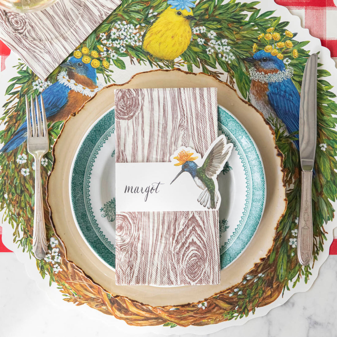 Songbird Wreath Placemat under a spring place setting.