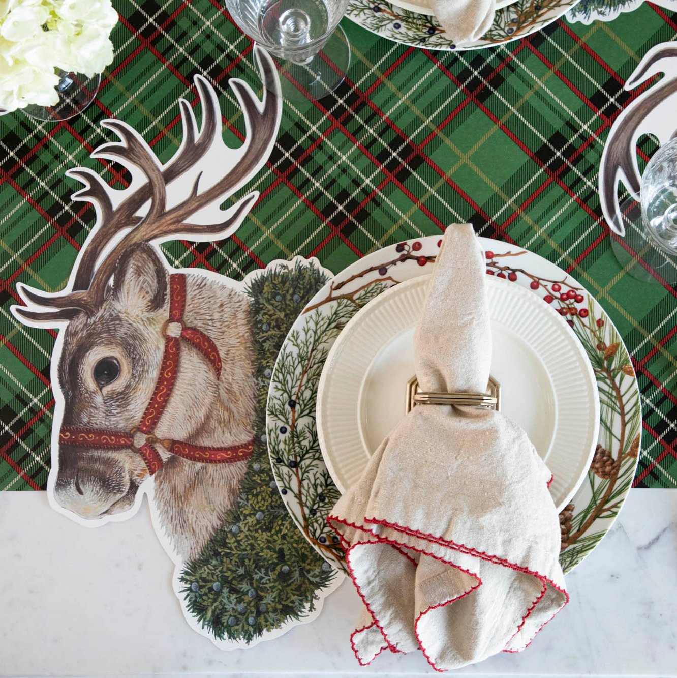 The Die-cut Reindeer Placemat under a festive Christmas place setting.