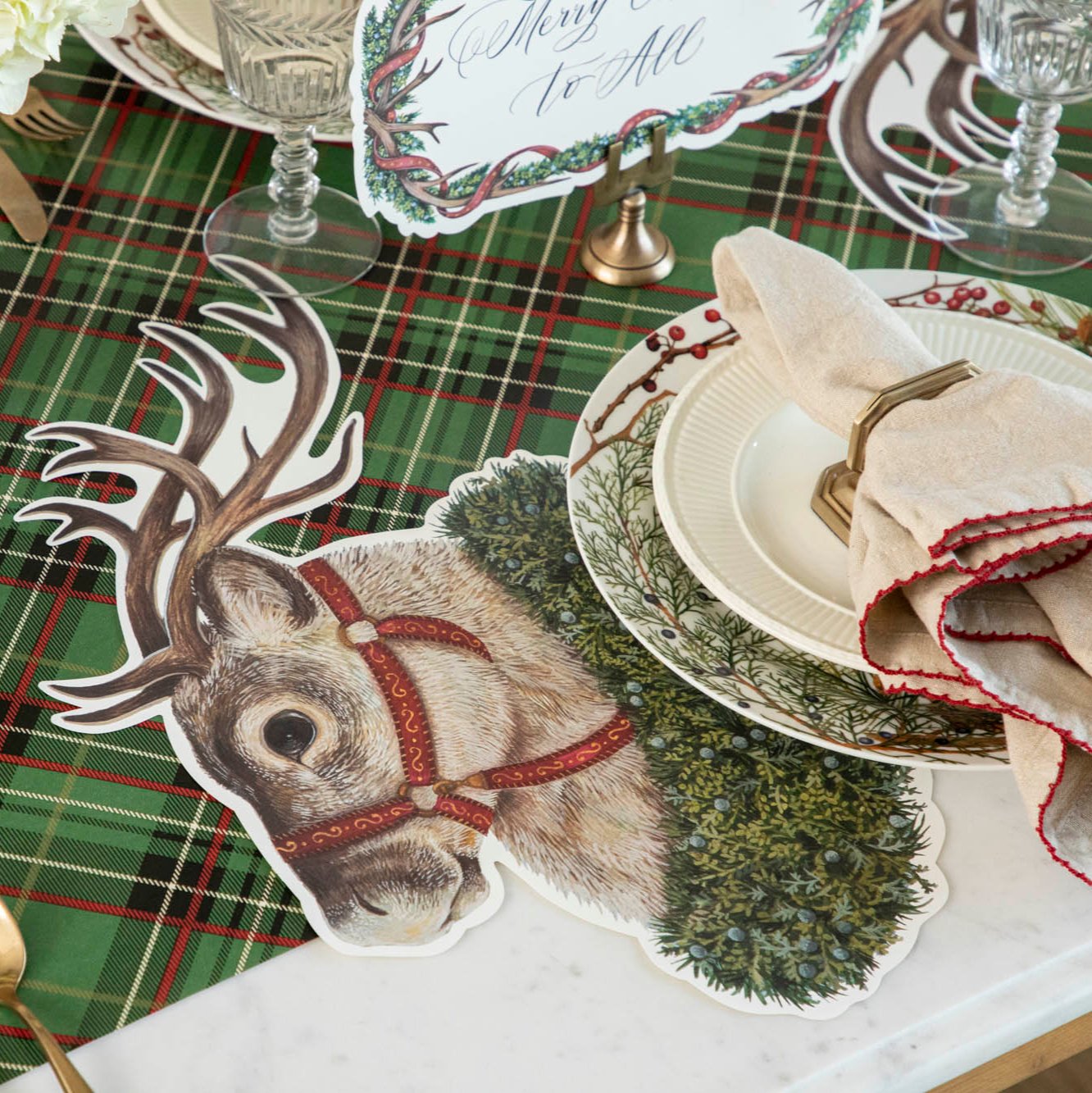 The Die-cut Reindeer Placemat under a festive Christmas place setting.