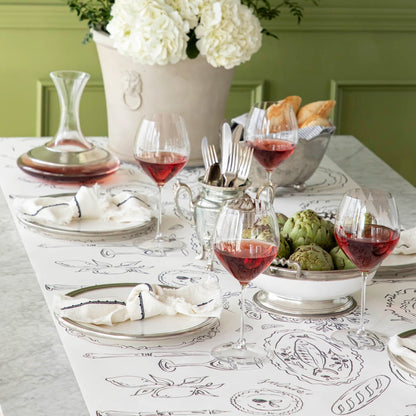 The Dinner Party Runner under an elegant table setting.