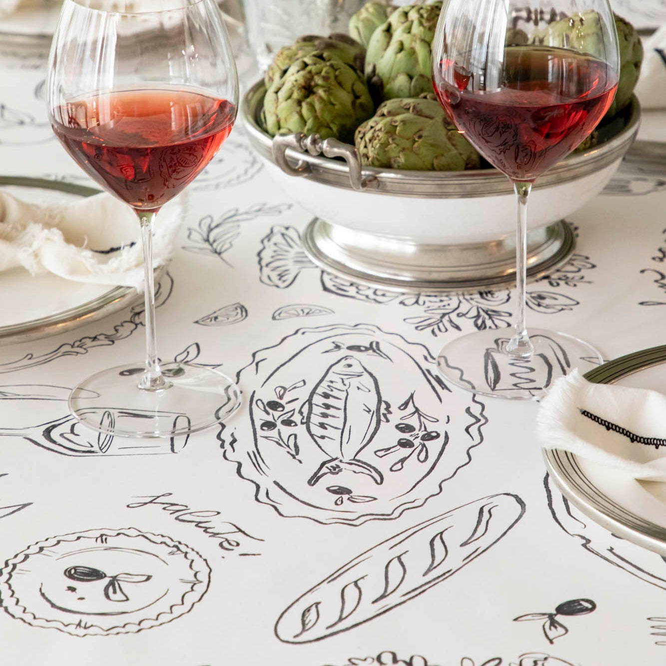 The Dinner Party Runner under an elegant table setting.