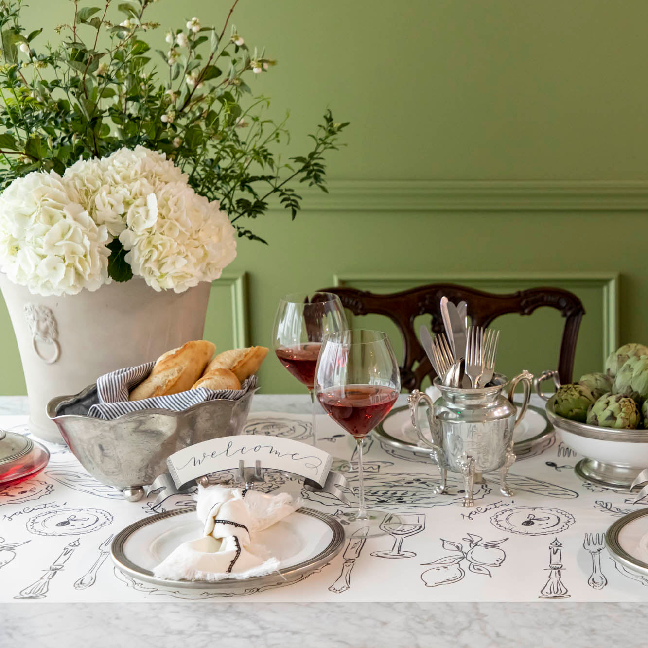 The Dinner Party Runner under an elegant table setting.