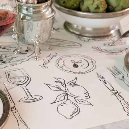 The Dinner Party Runner under an elegant table setting.