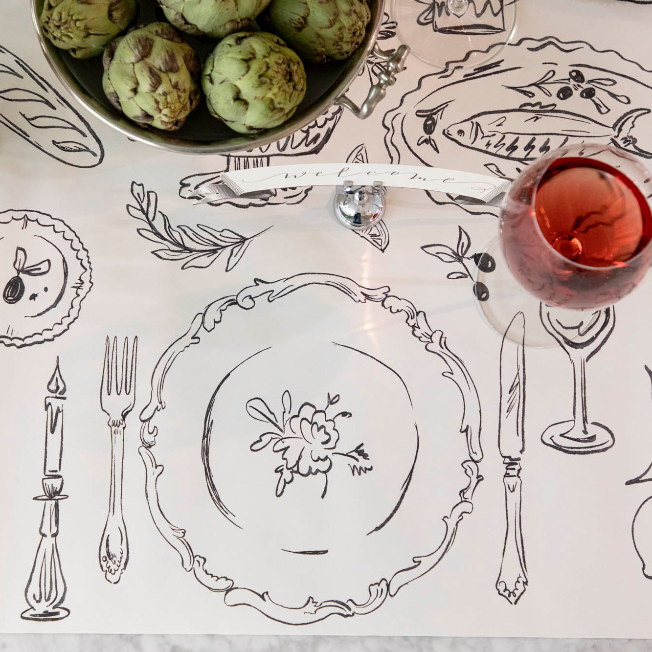 The Dinner Party Runner under an elegant table setting.