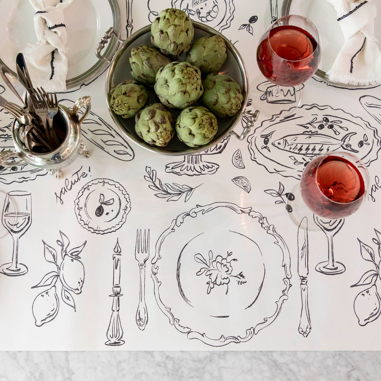 The Dinner Party Runner under an elegant table setting.