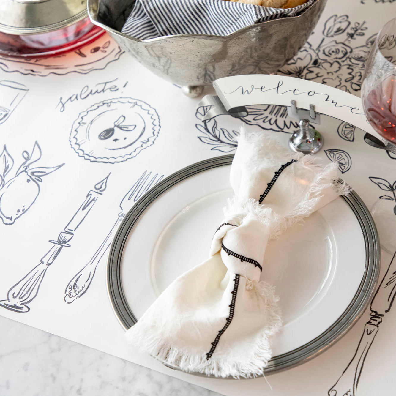 The Dinner Party Runner under an elegant table setting.