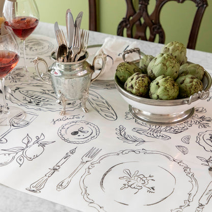 The Dinner Party Runner under an elegant table setting.