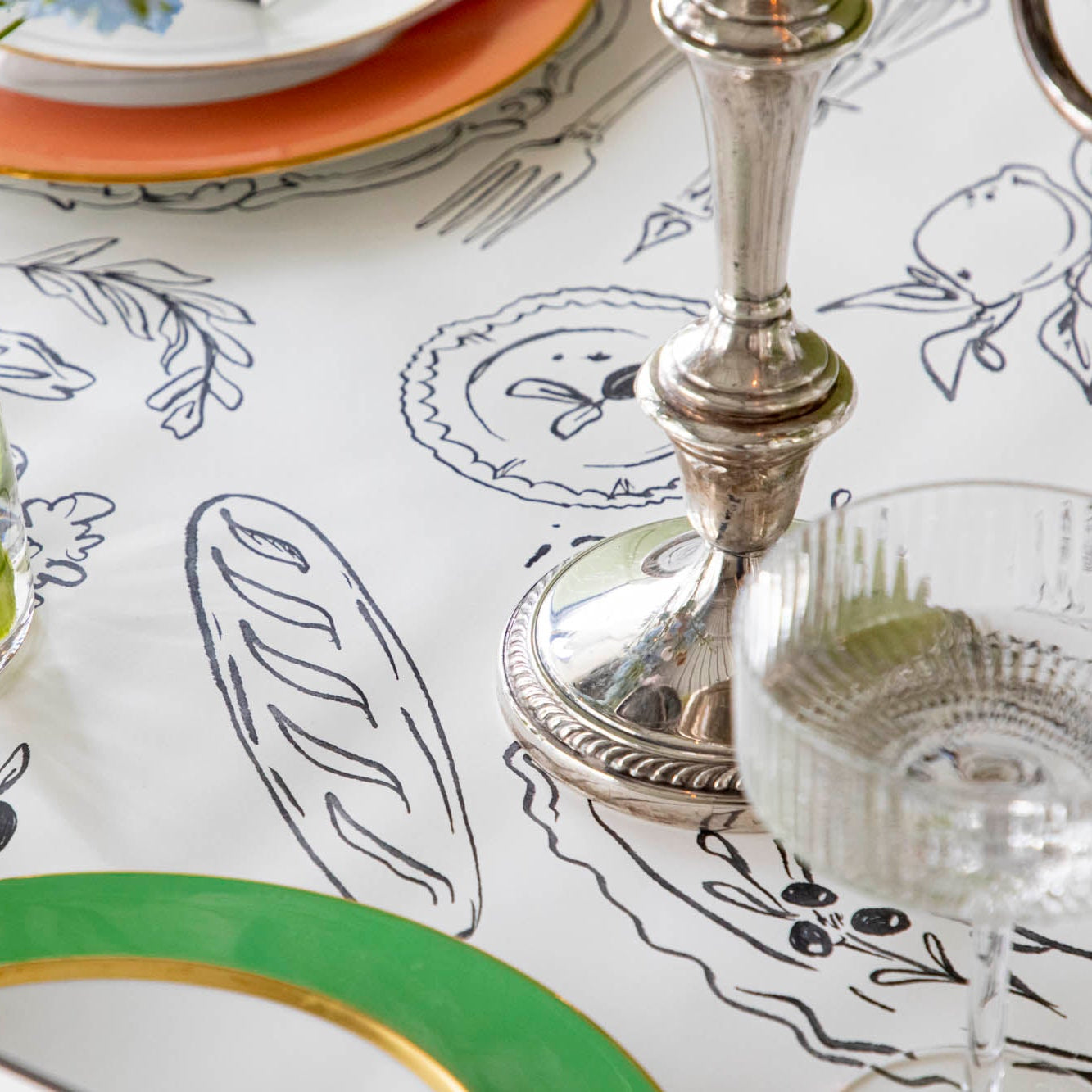 The Dinner Party Runner on a colorful table setting.