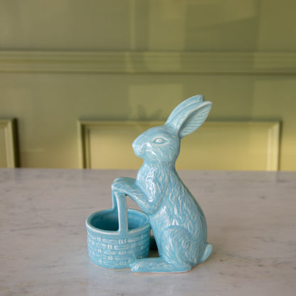 Side view of the Blue Ceramic Embossed Bunny Holding Basket in front.