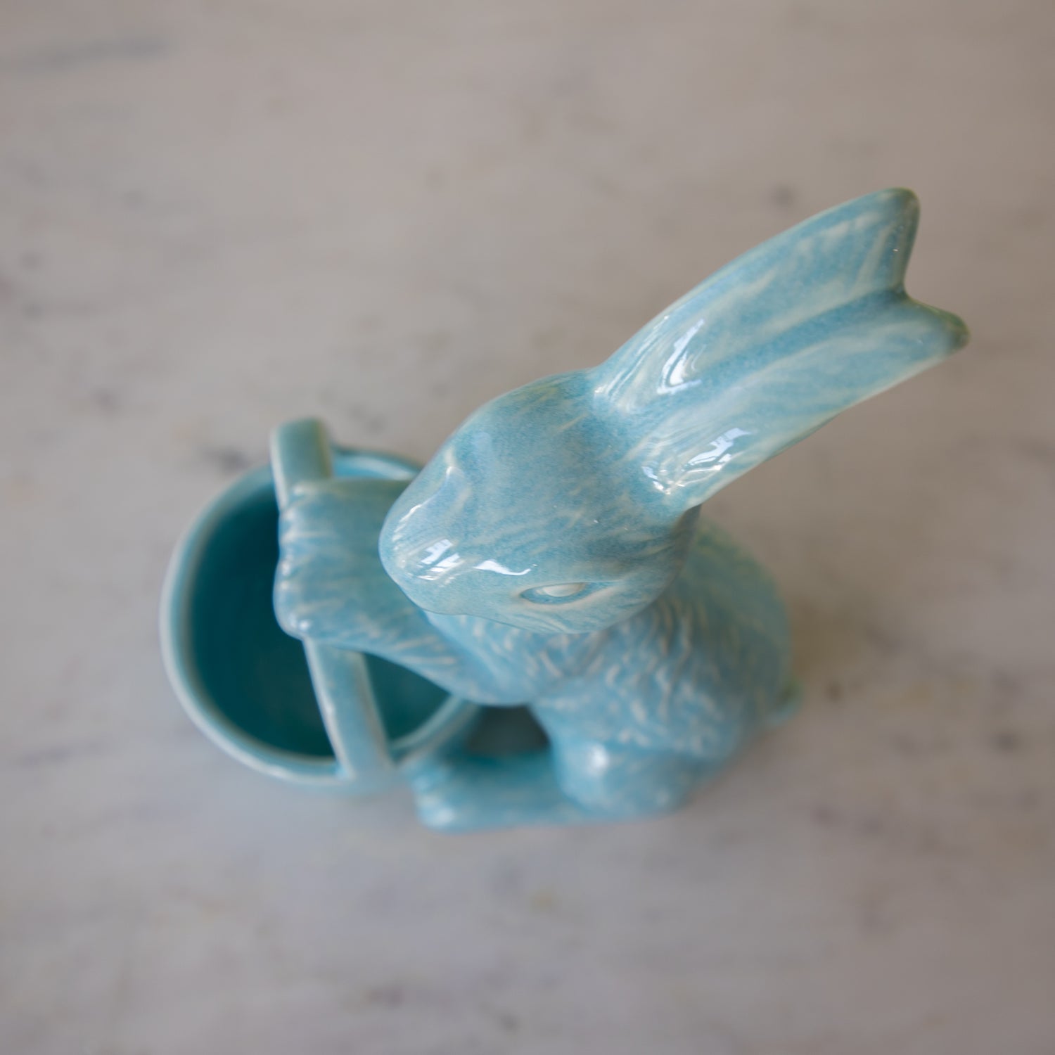 Top down view of the Ceramic Embossed Bunny Holding Basket showing the empty inside of the basket.