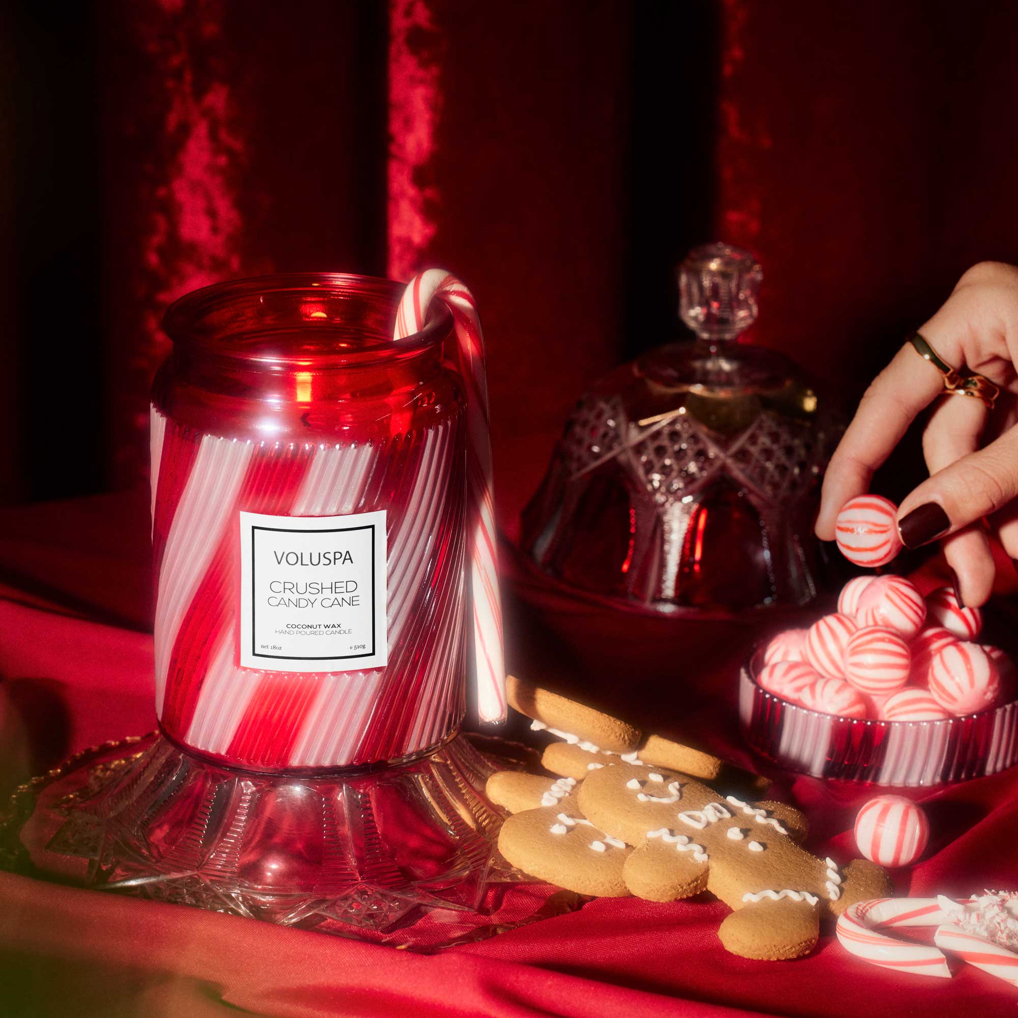 Red and white candy striped glass candle 