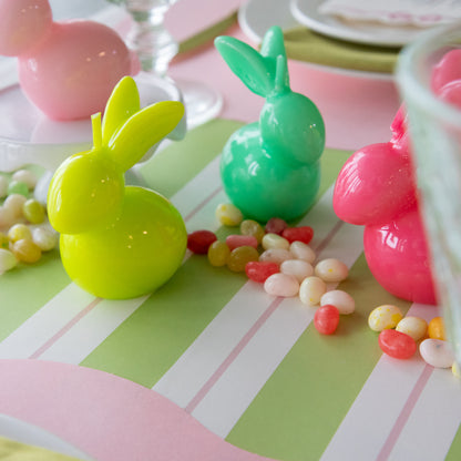 Bunny Candles in assorted colors styled in the center of two spring place settings.