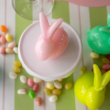 Bunny Candles in assorted colors styled in the center of two spring place settings.