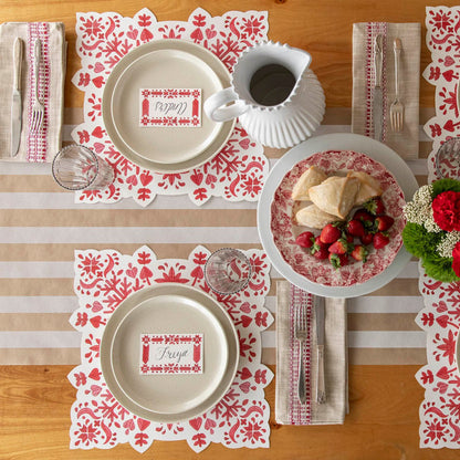 An elegant table setting with the Kraft Stripe Runner underneath and Die-cut Fair Isle Placemat with dinnerware on top.