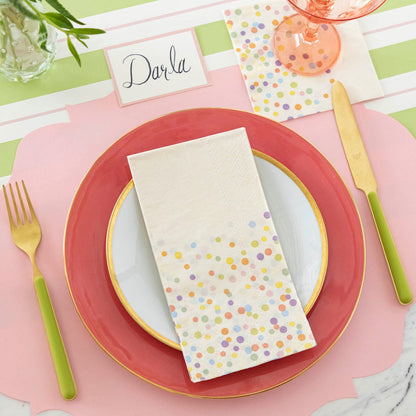 Confetti Sprinkles Guest Napkin centered on a plate, on a spring themed place setting.