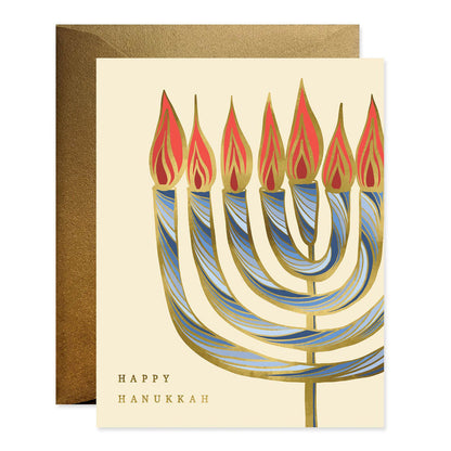 Front of card with illustration of a menorah on it stating &quot;Happy Hanukkah&quot; and an envelope behind the card. 