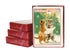 Three stacked card sets next to a front facing boxed card set of the Christmas Cats depicting two cats holding a paper in a snowy woods scene and  "Christmas Greetings" at the top of the card.