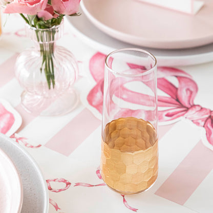 A table setting with Vitorrio Stemless Glassware plates, and napkins.