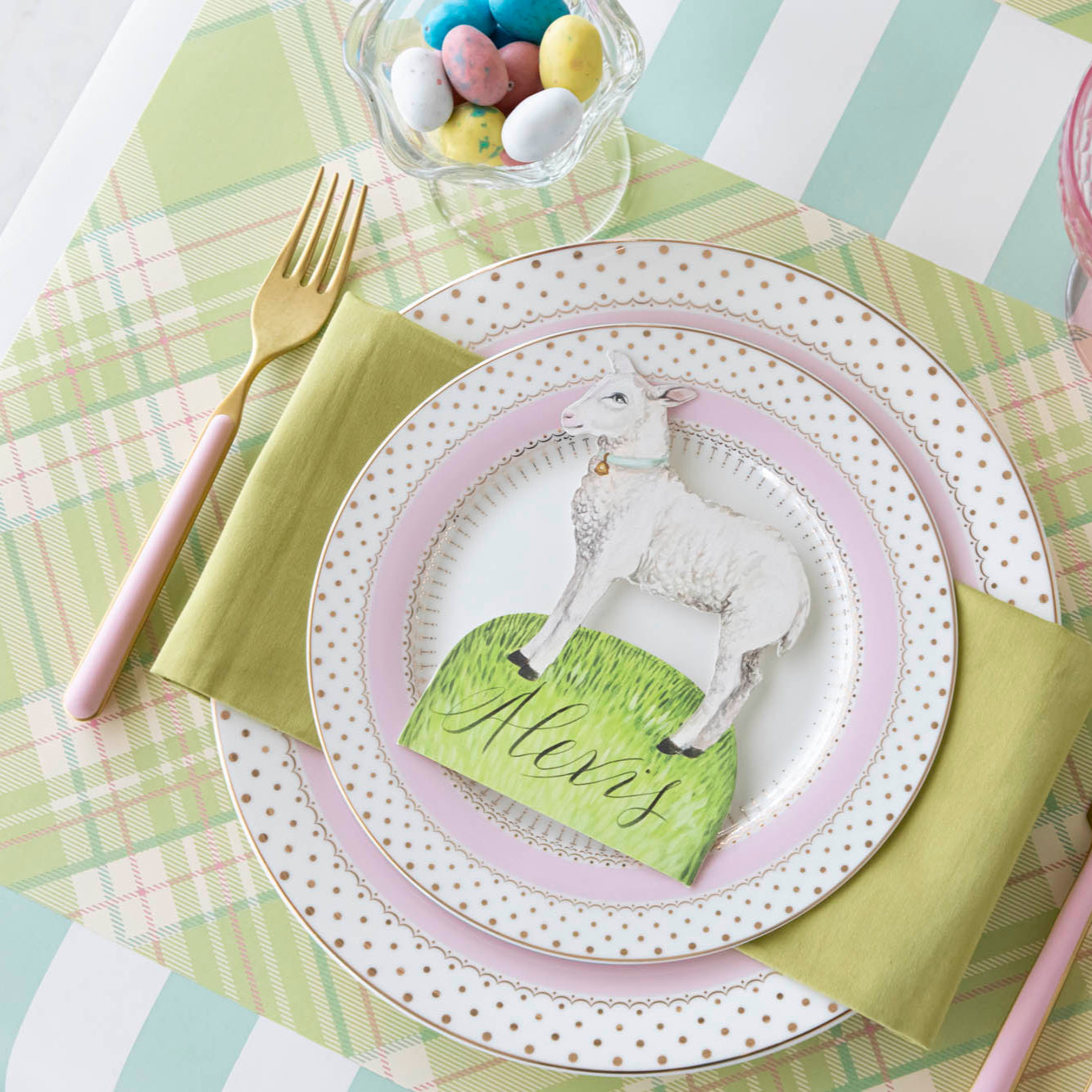 Bright Green Plaid Placemat under a place setting with gold and pink dinnerware.