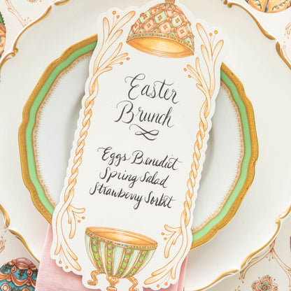 A close up of the Exquisite Egg Table Card with a menu written on it.