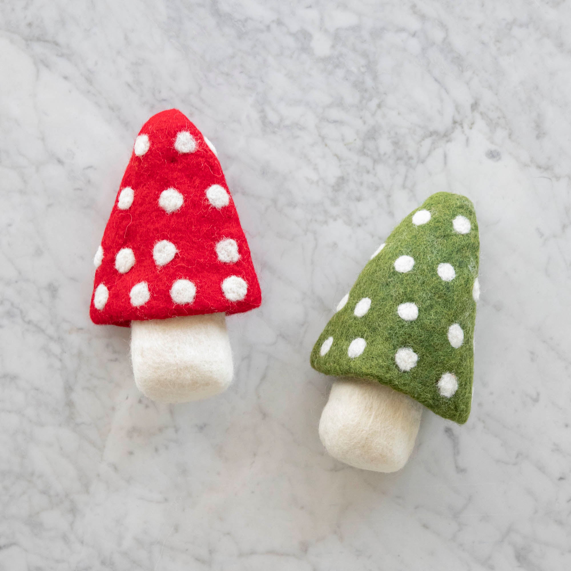 Felt Mushrooms.  One with a red top one with a green top