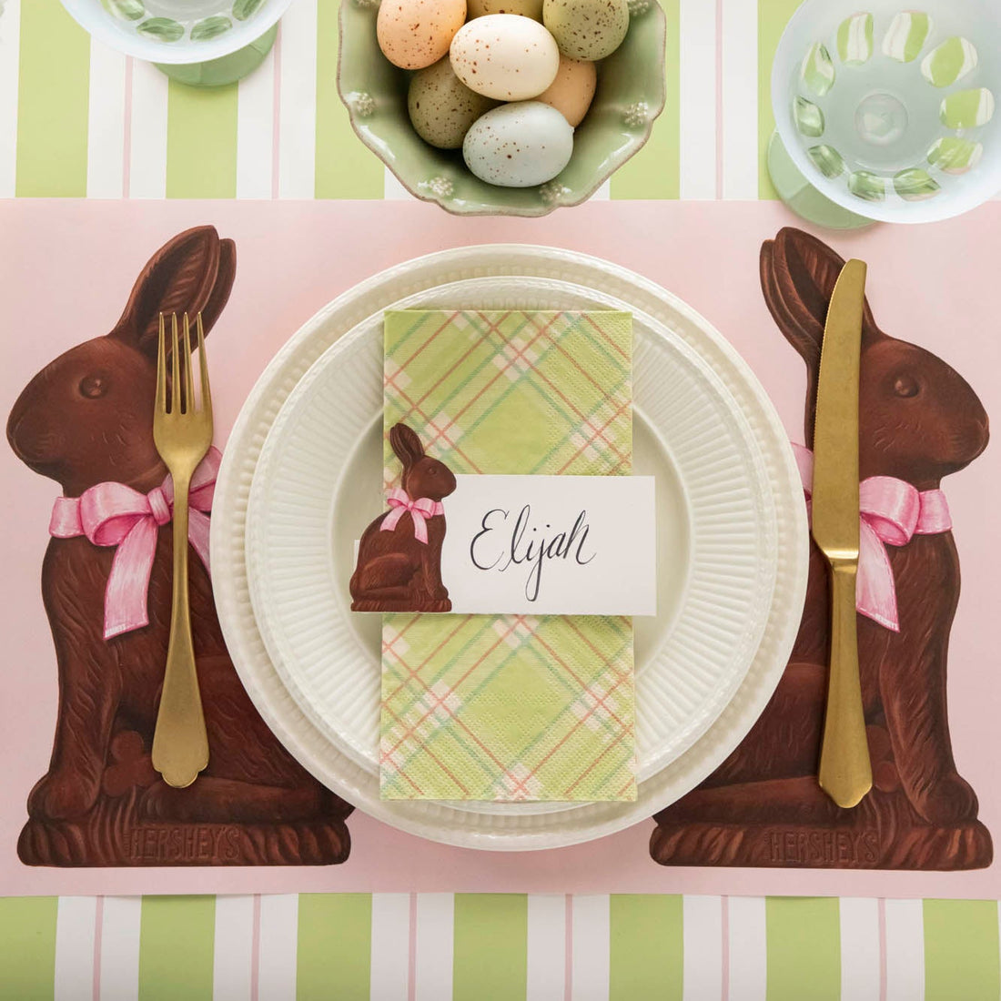 Hershey's Chocolate Bunnies Placemat under a place setting for one, on an Easter themed table setting.