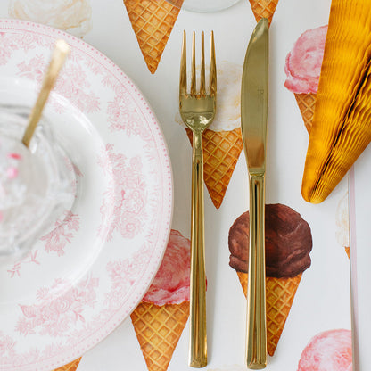 Ice Cream Cones Placemat under a place setting with gold flatware.