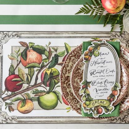The Heirloom Apples Placemat under an elegant place setting, from above.