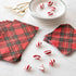 Two stacks of Red Plaid Napkins, one of Guest and one of Cocktail Napkins, on a white table with dessert plates and peppermints.