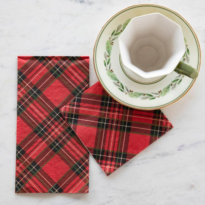 Two Red Plaid Napkins, one Guest and one Cocktail, tucked under the saucer of a tea cup.