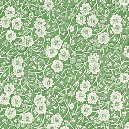 A square cocktail napkin featuring a dense pattern of white flowers, stems and leaves on a green background.