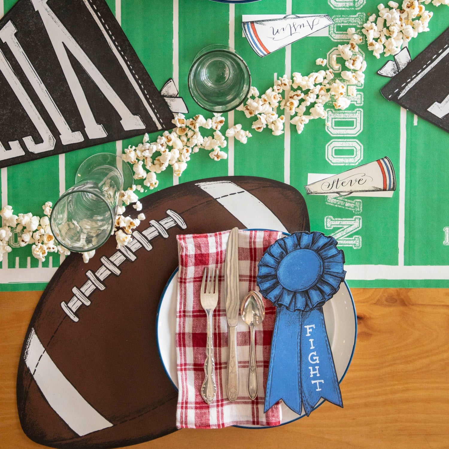 Die-cut football placemat on a touchdown runner table setup.