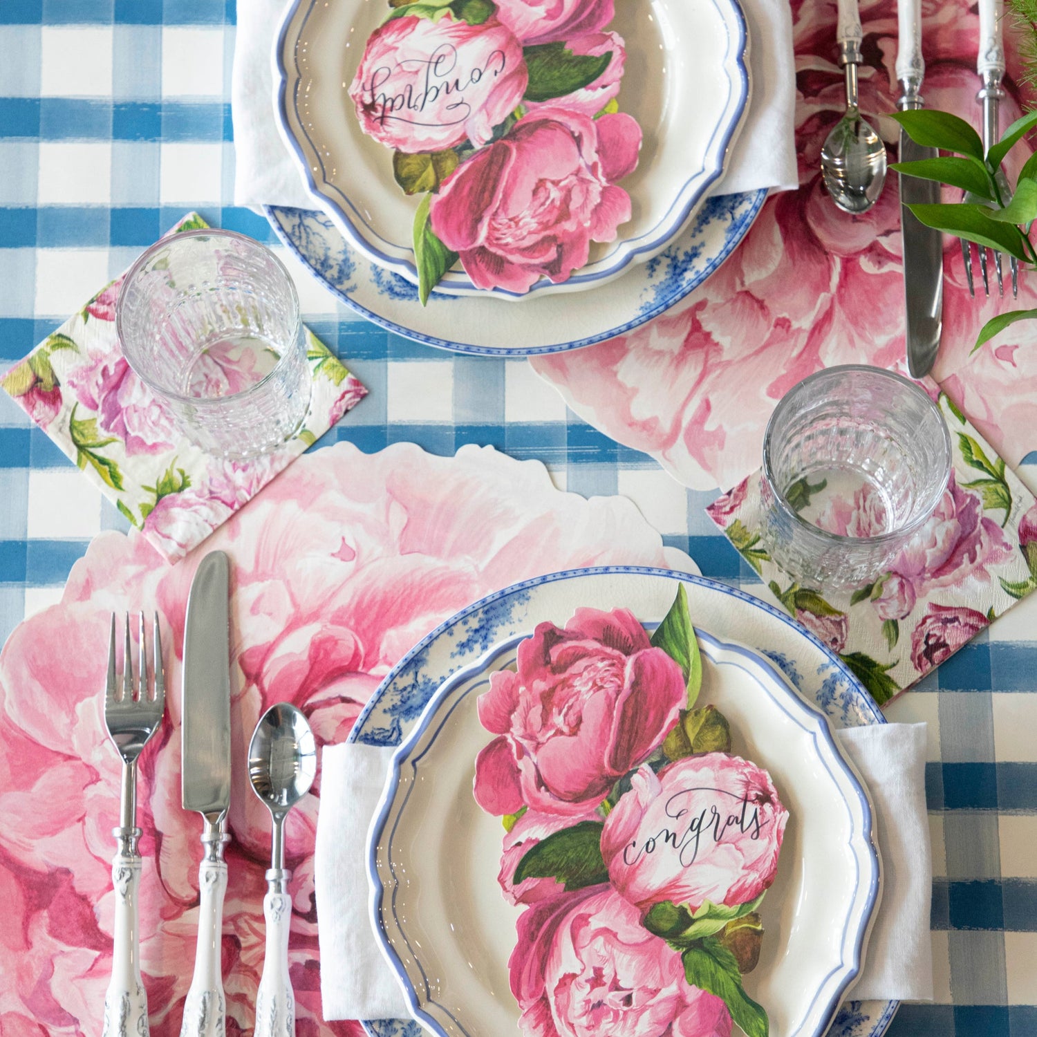 Blue Painted Check Runner under a Peony themed table setting for two.