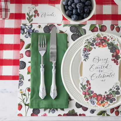 The Red Painted Check Runner on a table setting, underneath the Wild Berry Placemat.