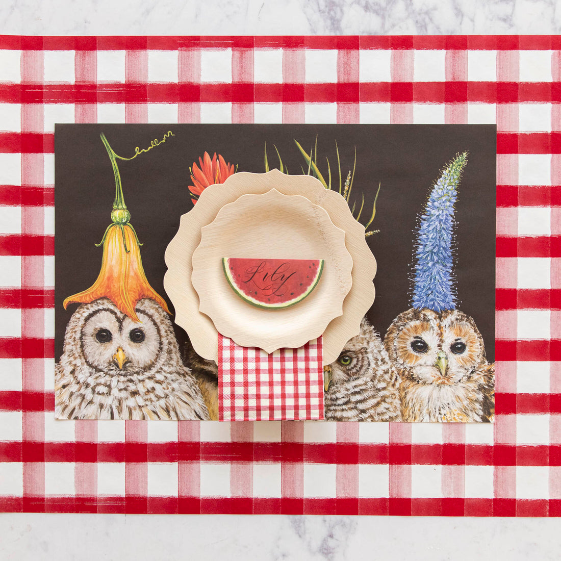 A picnic-style place setting featuring the Red Painted Guest Napkin on the plate.