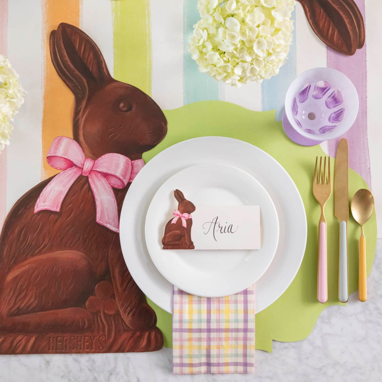 Die-cut Bright Green French Frame Placemat styled under a colorful Easter themed place setting for one.