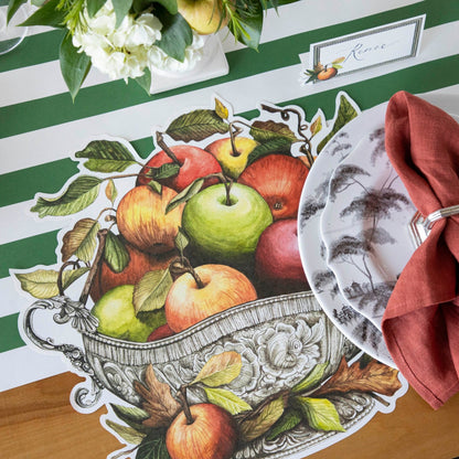 The Die-cut Apple Arrangement Placemat under an elegant place setting.