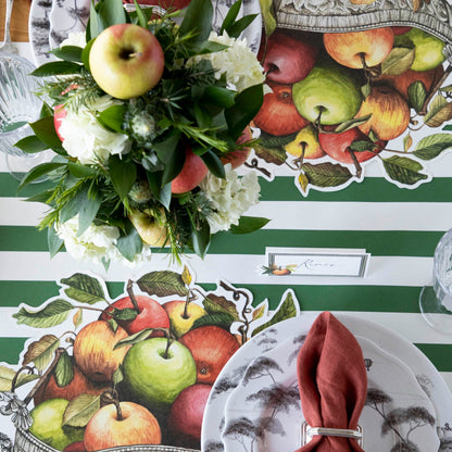 The Die-cut Apple Arrangement Placemat under an elegant table setting for two, from above.