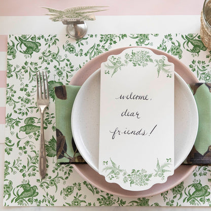 The Green Regal Peacock Placemat under an elegant place setting, from above.