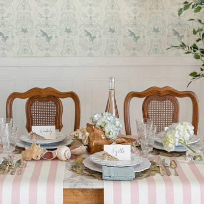 Pink Classic Stripe Runner under a shell themed table setting for three.