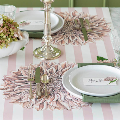 Die-cut Dahlia Placemat under a place setting for one and Pink Classic Stripe Runner underneath.