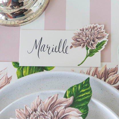 Dahlia Place Card with &quot;Marielle&quot; written on it, behind a place setting for one.