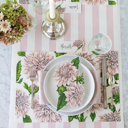 Delightful Dahlias Placemat under a place setting for one, on an elegant table.