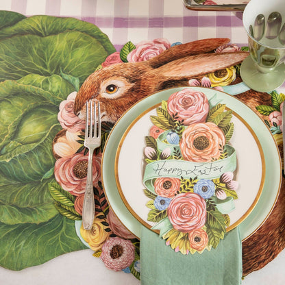 The Die-cut Bunny Bouquet Placemat under an elegant Easter-themed place setting.