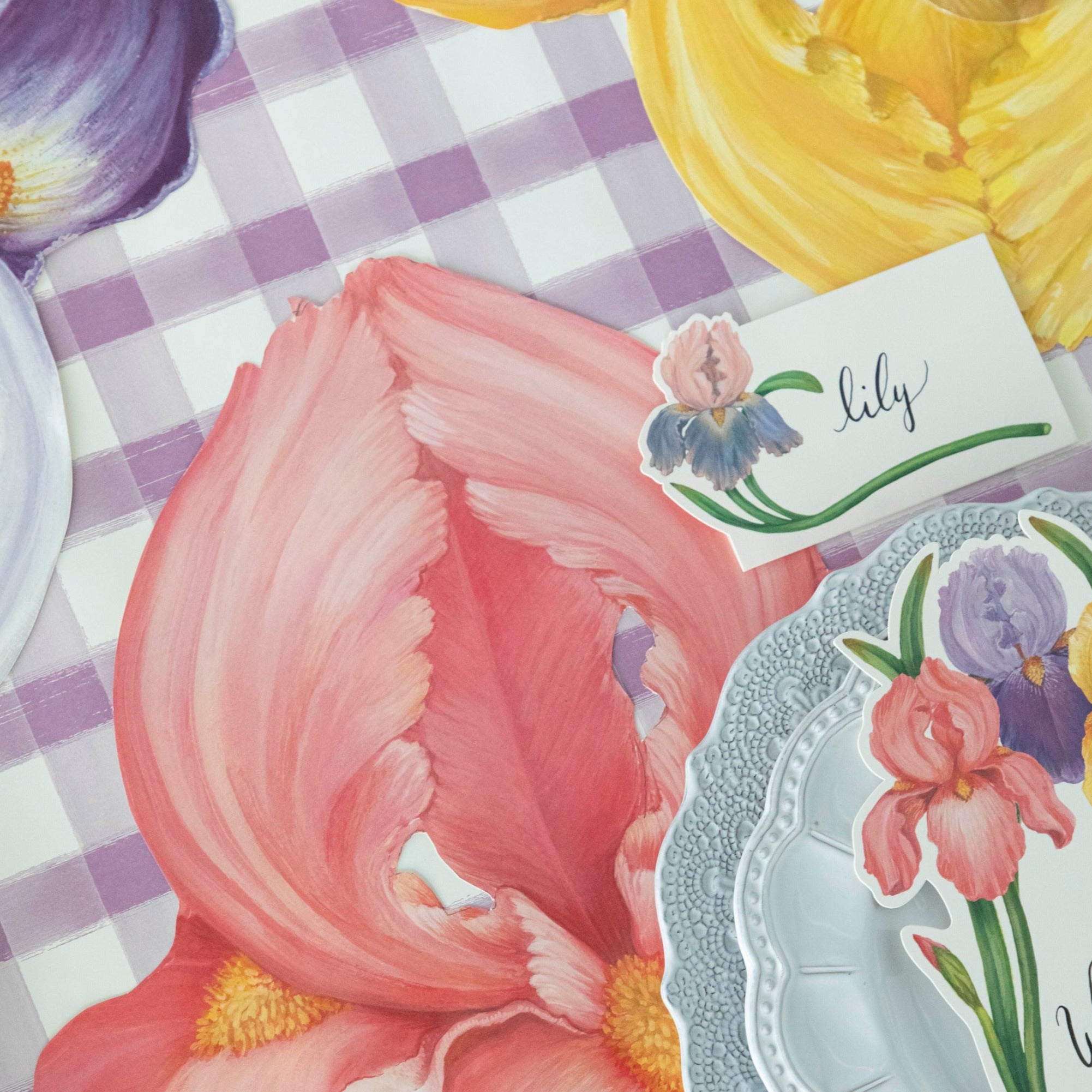 Close-up of the pink Die-cut Iris Placemat under an elegant place setting, showing the artwork in detail.