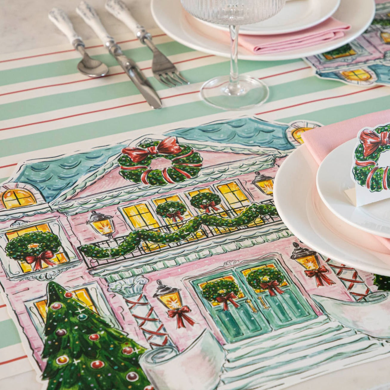 The Die-cut Holiday Home Placemat under an elegant holiday place setting.