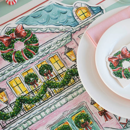 Close-up of the Die-cut Holiday Home Placemat under an elegant place setting, showing the artwork in detail.