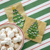 Two Vintage Christmas Tree Napkins, one Cocktail and one Guest, tucked under a bowl of holiday treats on the Green & Red Awning Stripe Runner.