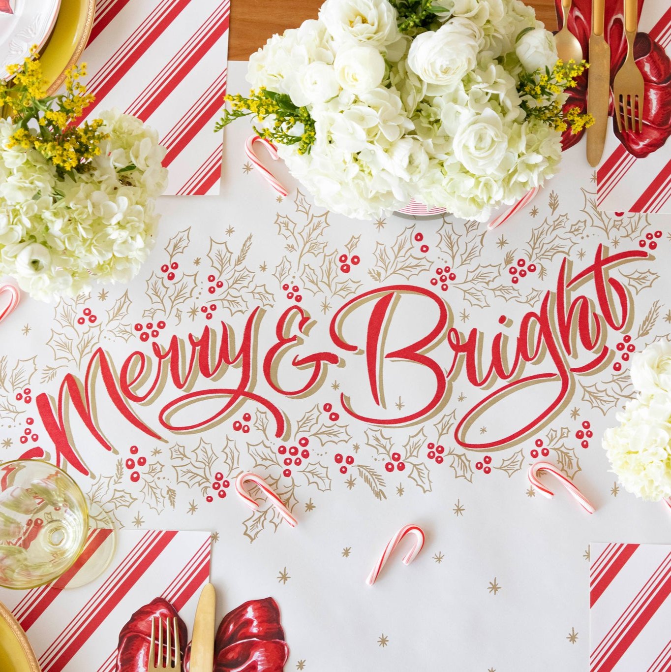 The Merry &amp; Bright Runner styled on a festive table setting with candy canes sprinkled across the runner.